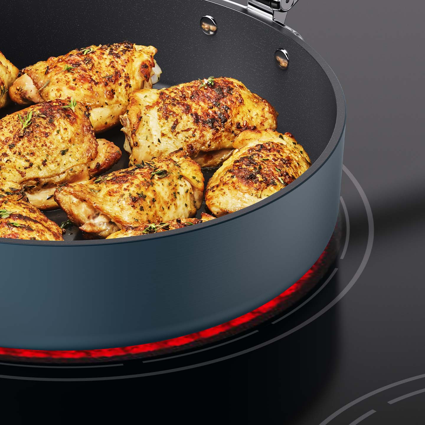 Space Cooking Blue Sauté Pan Cooking Chicken on Induction Hob | Joseph Joseph