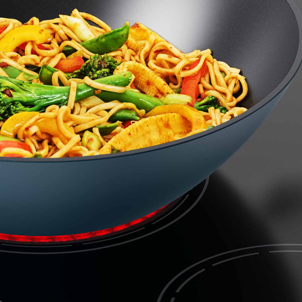 Space Cookware Blue Wok Cooking Stir Fry on Induction Hob | Joseph Joseph
